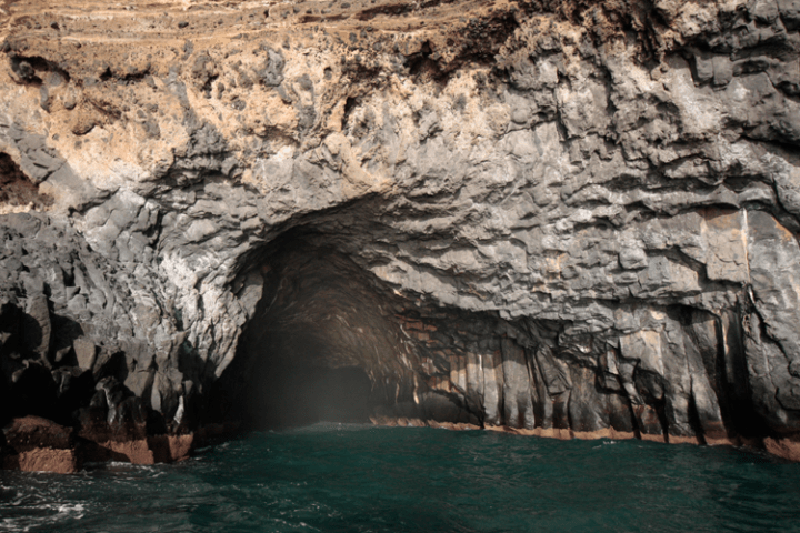 a group of people on a cave