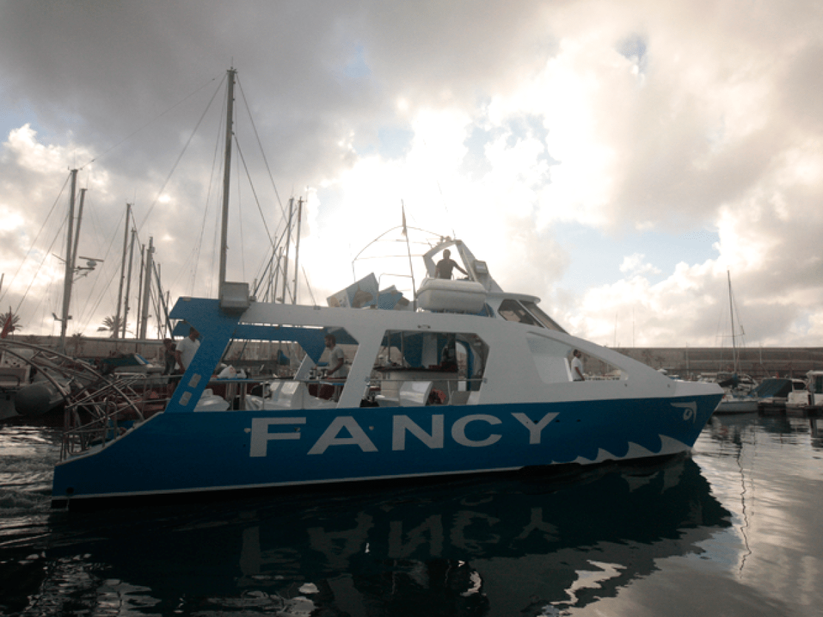 a boat is docked next to a body of water
