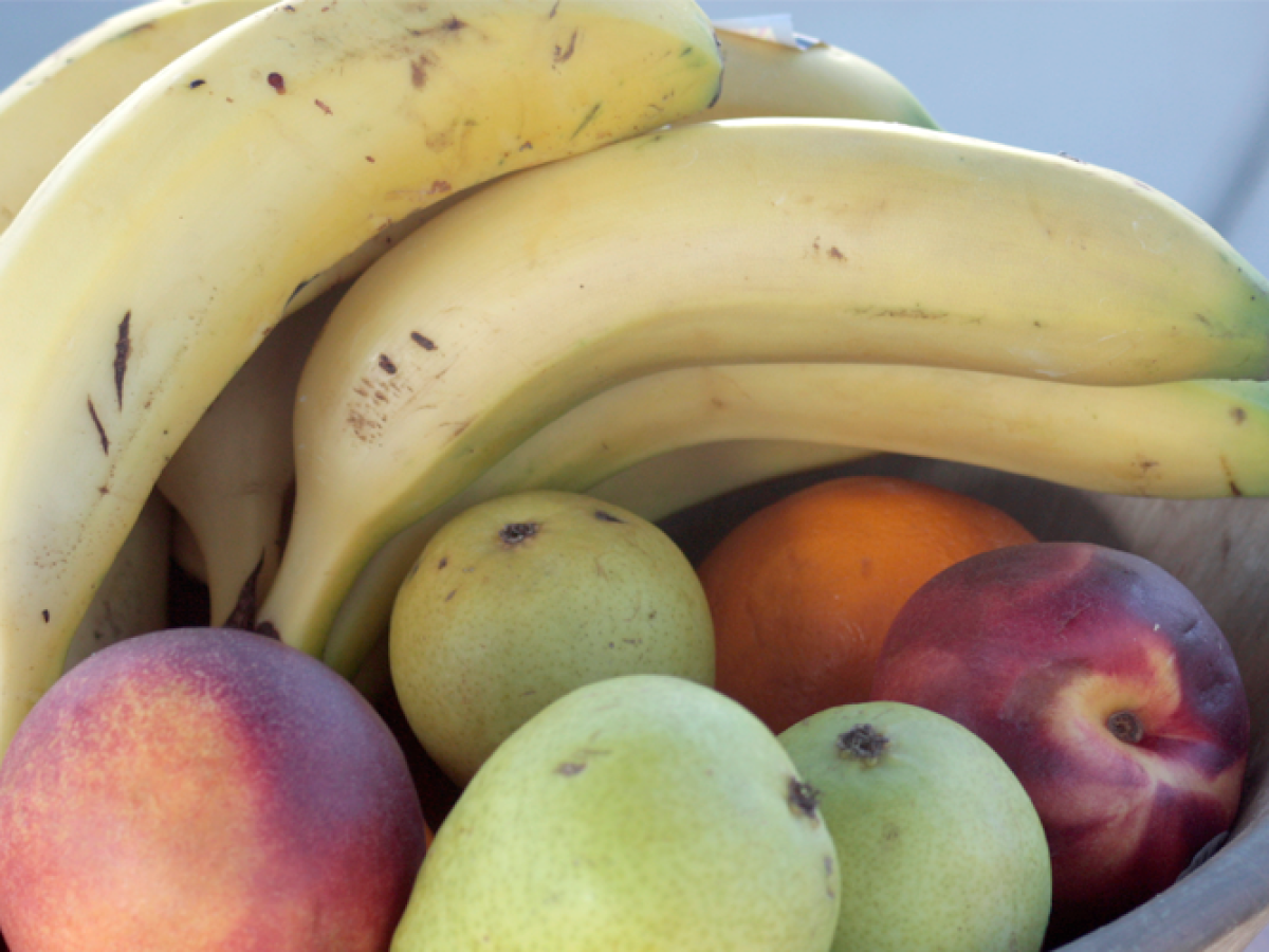 a banana and a bowl of fruit