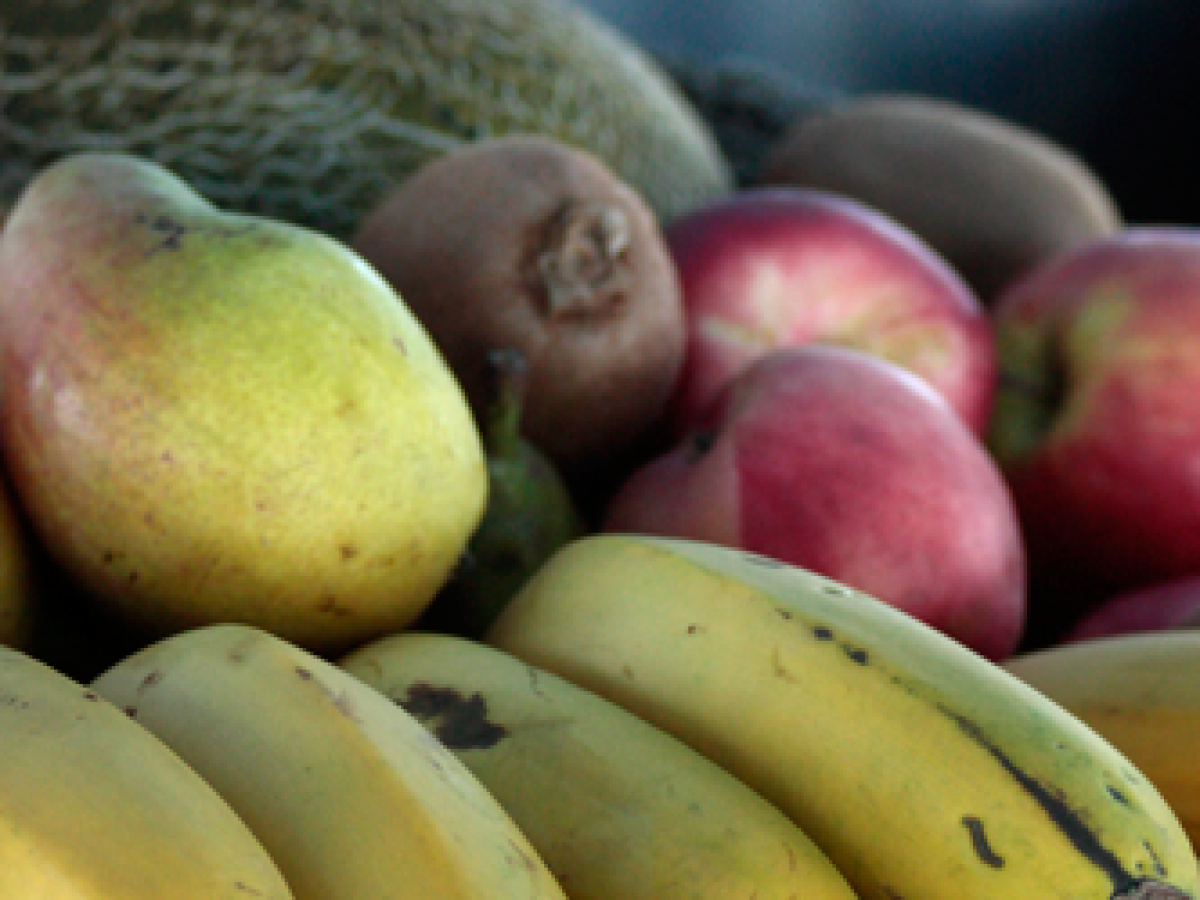 a pile of fruit sitting on a table
