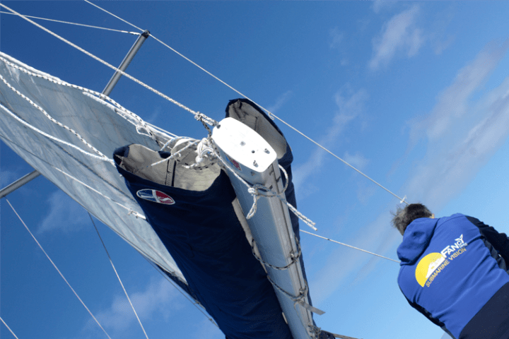 a person flying through the air on a clear blue sky