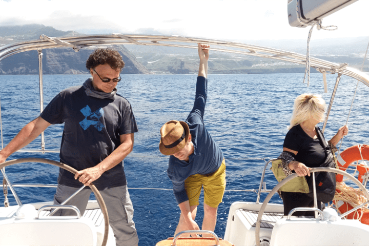 a group of people on a boat in the water