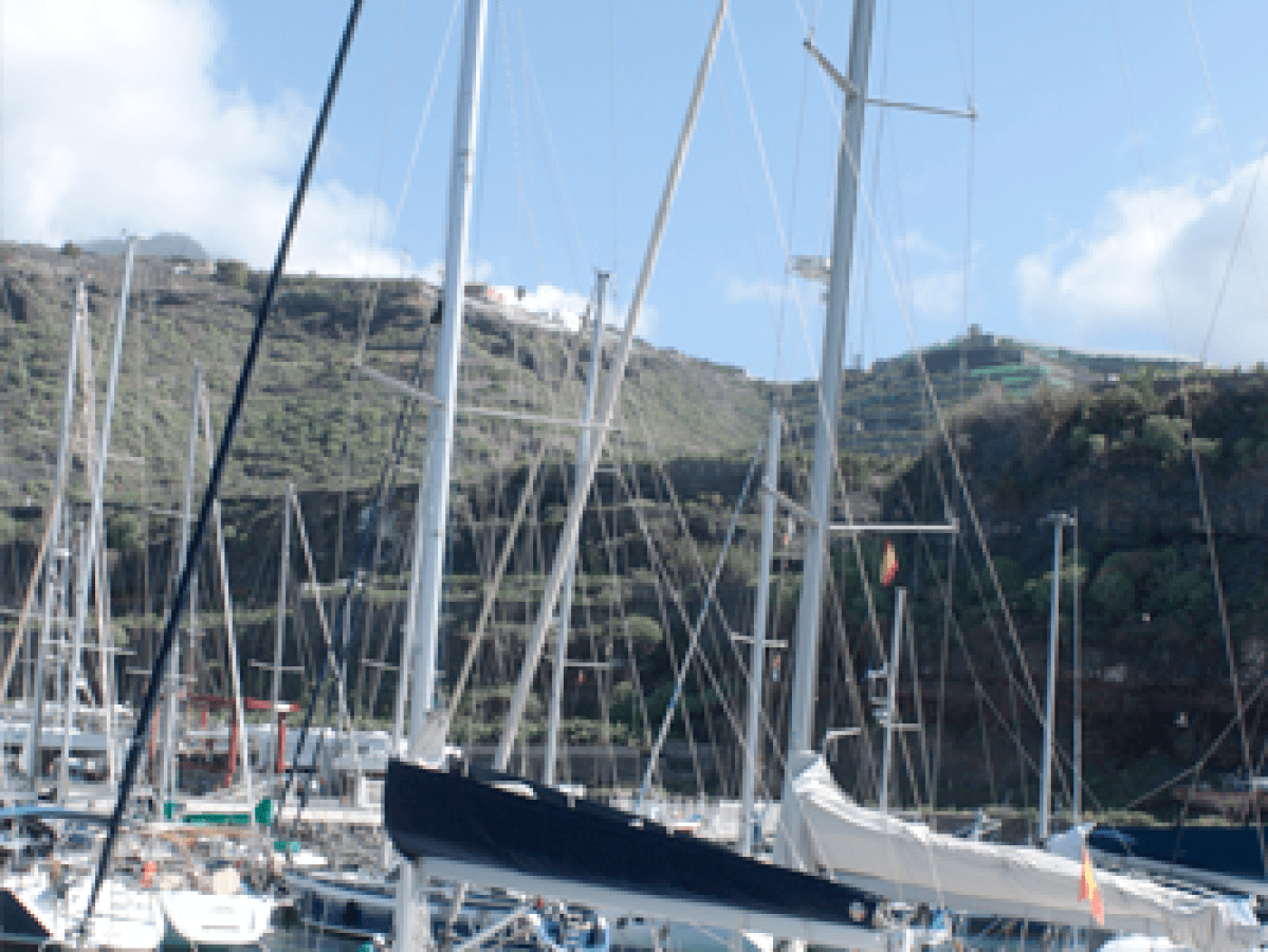 a boat is docked next to a body of water